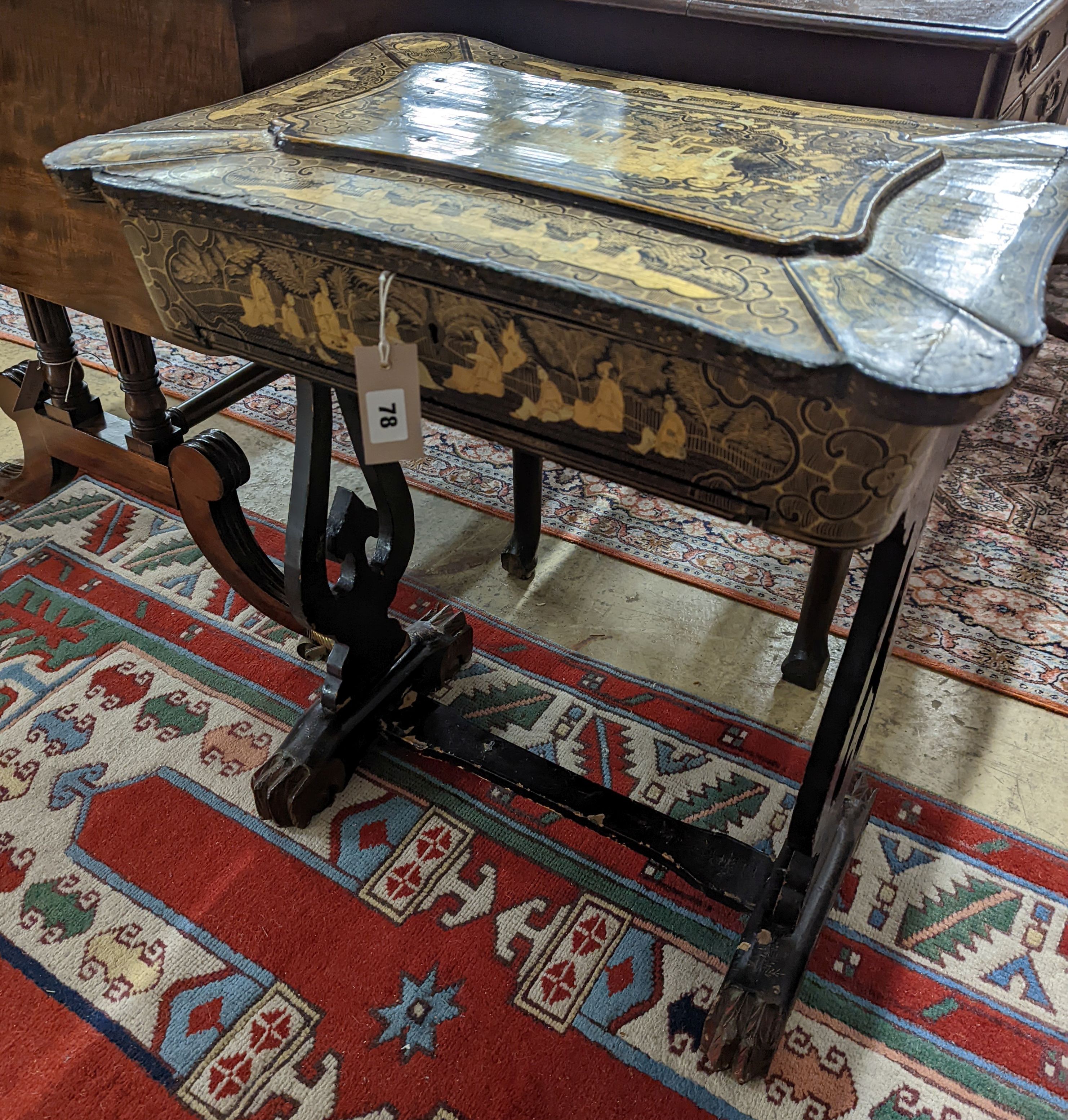 A mid 19th century Chinese export lacquer work table. W-59cm,D-41cm, H-66cm., containing bone accessories